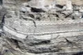 Гипс (с тёмными прослоями кальцита) с минискладчатой текстурой, верхняя пермь (Нью-Мексико, США)
