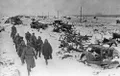 Советские солдаты проходят мимо колонны разбитой немецкой техники. Март 1944