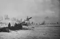 Советские артиллеристы ведут огонь по отступающим немецким войскам в районе города Бердичева, Житомирская область. Январь 1944