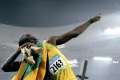 Ямайский спринтер Усейн Болт после победного финиша на Играх XXIX Олимпиады. 2008
