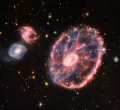 Галактика Колесо Телеги и галактики-компаньоны в инфракрасном диапазоне