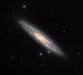 Спиральная галактика с баром NGC 253
