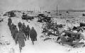 Советские солдаты проходят мимо колонны разбитой немецкой техники. Март 1944