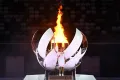 Японская теннисистка Наоми Осака после зажжения олимпийского огня на Играх XXXII Олимпиады в Токио. 2021