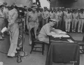 Адмирал флота Честер Нимиц подписывает Акт о капитуляции Японии на борту линкора «Миссури»