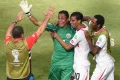 Сборная Коста-Рики празднует победу над сборной Италии