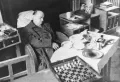 Александр Алехин в отеле г. Эшторил за шахматной доской. 1946