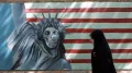 Американское граффити на стене бывшего посольства США, изображающее США как «великого сатану». Тегеран. 2006
