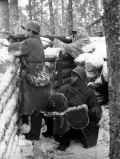 Советский пулемётчик ведёт огонь по противнику. Декабрь 1939