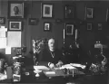 Александр Протопопов в кабинете за письменным столом. 1916